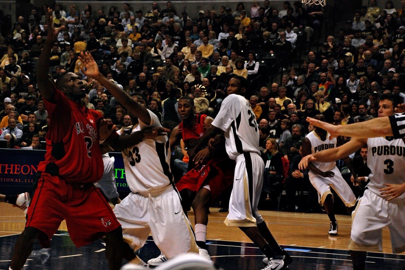 Purdue Boilermakers basketball players competing for a rebound